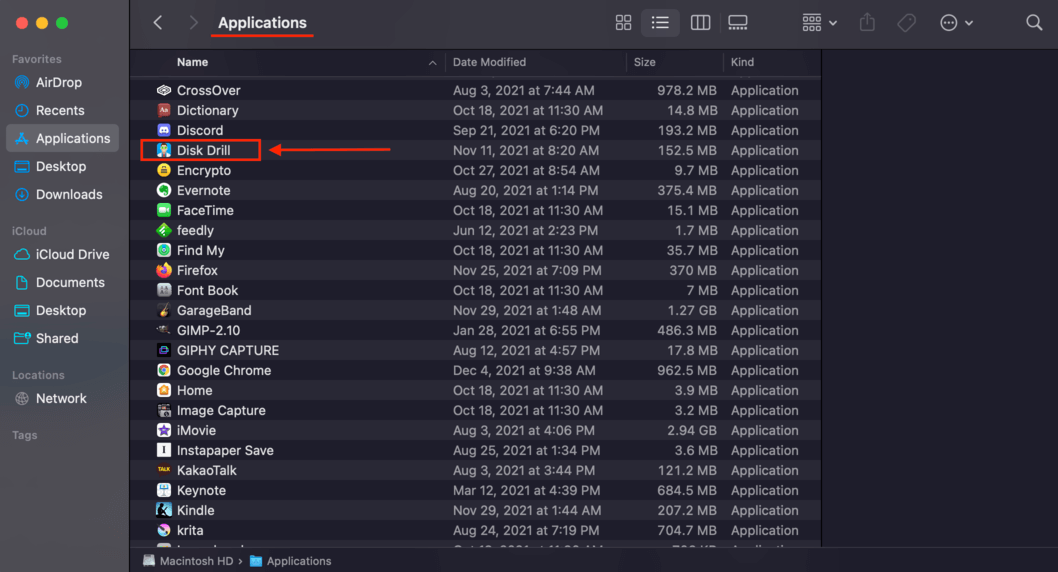 applications folder window with a pointer towards the disk drill app