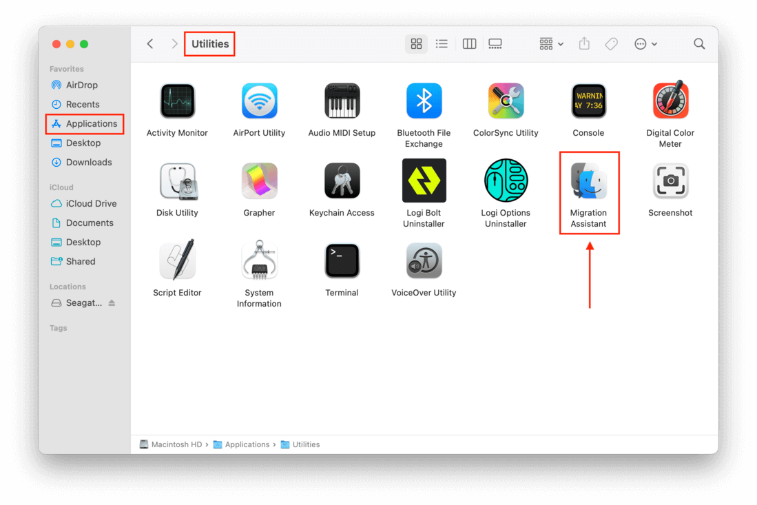 Applications window with a pointer towards the Migration Assistant application icon