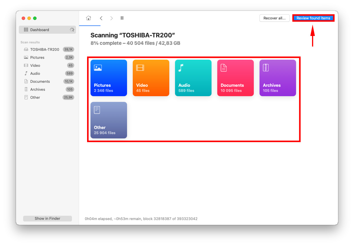 Disk Drill window showing the types of recovered files and a pointer towards the Review Found Items button
