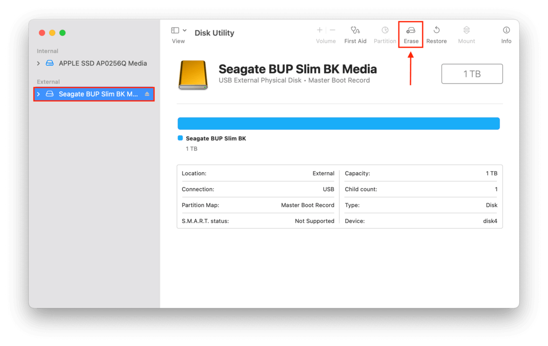 Disk Utility window showing a pointer towards the Erase button