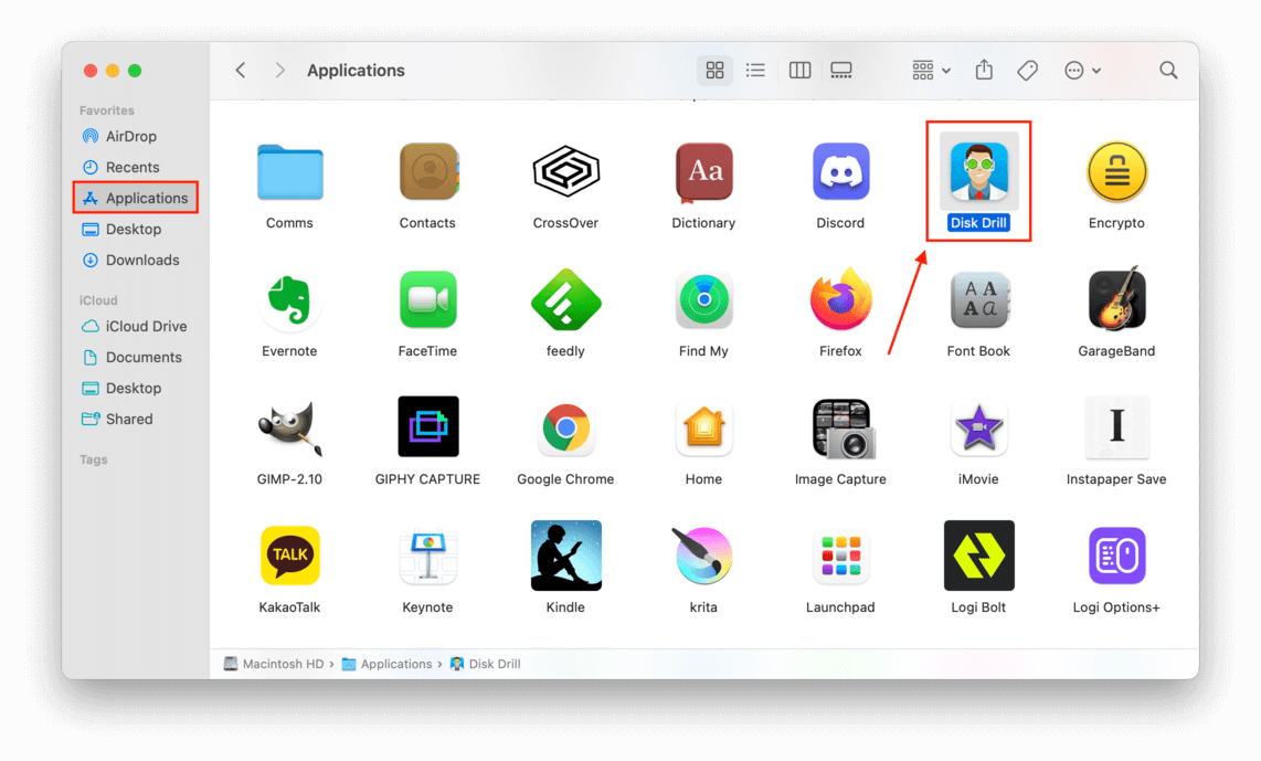 Applications window showing a pointer towards the Disk Drill application icon
